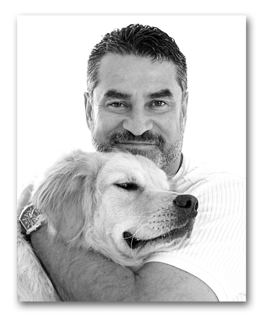 Arthur Cervantes in a personal portrait with his dog